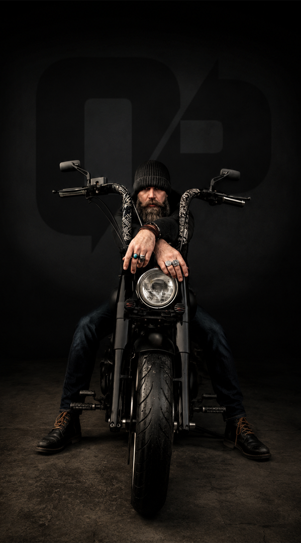 Wade Callahan seated on a custom Obsidian motorcycle